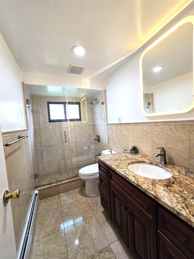 1 Terry Ln, Jericho, NY 11753 - bathroom featuring a baseboard radiator, vanity, a stall shower, tile walls, and toilet
