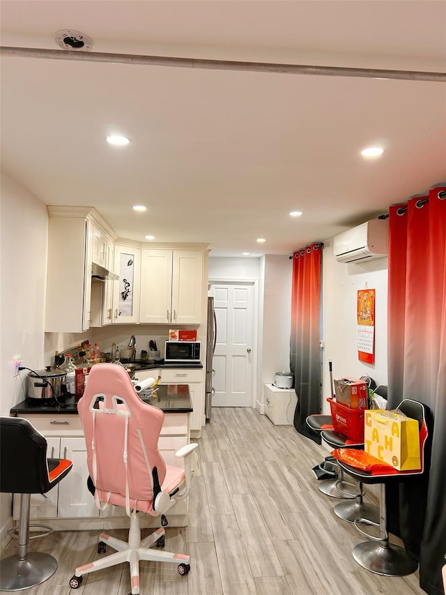 54-23 153rd St, Flushing, NY 11355 - home office featuring a wall mounted air conditioner, light wood finished floors, recessed lighting, and a sink