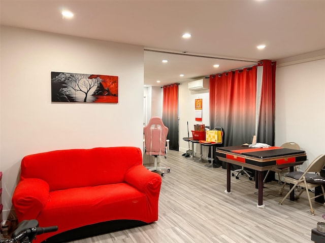54-23 153rd St, Flushing, NY 11355 - playroom featuring a wall mounted air conditioner, wood finished floors, and recessed lighting