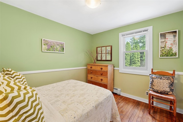 40 Maidstone Ave, East Hampton, NY 11937 - bedroom featuring a baseboard heating unit, hardwood / wood-style flooring, and baseboards
