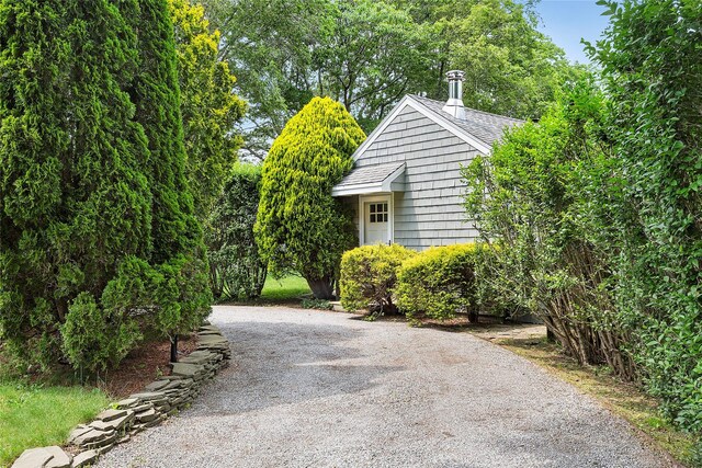 40 Maidstone Ave, East Hampton, NY 11937 - view of property exterior featuring gravel driveway