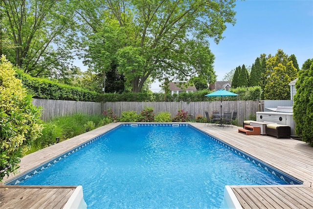 40 Maidstone Ave, East Hampton, NY 11937 - view of swimming pool with a fenced backyard, a deck, a hot tub, and outdoor dining space