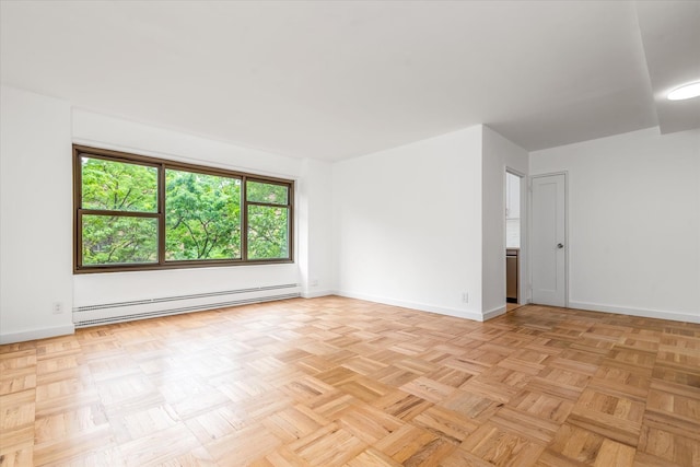 33-34 Crescent St Unit 5D, Astoria, NY 11106 - empty room featuring a baseboard radiator and baseboards