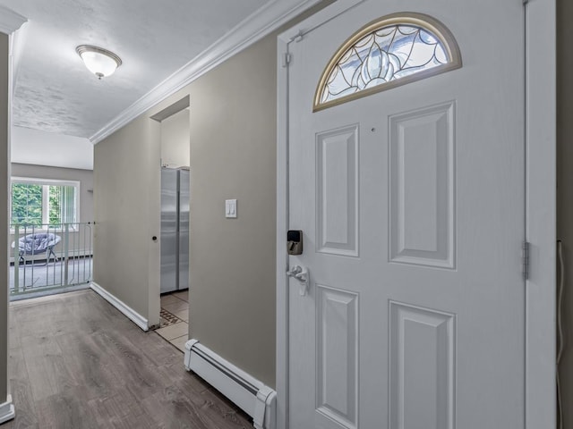 2 Pinetop Dr, Shirley, NY 11967 - foyer entrance with a baseboard radiator, wood finished floors, and crown molding