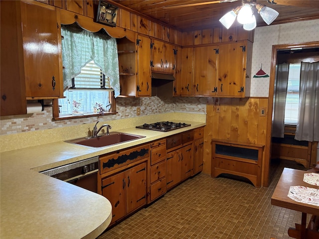 324 Westside Ave, Haverstraw, NY 10927 - kitchen featuring a sink, light countertops, ceiling fan, gas cooktop, and wainscoting