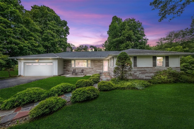 38 Degarmo Hills Rd, Wappingers Falls, NY 12590 - ranch-style house featuring a front yard, a chimney, an attached garage, driveway, and stone siding