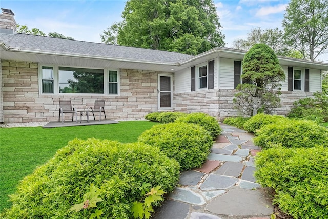 38 Degarmo Hills Rd, Wappingers Falls, NY 12590 - view of front facade featuring stone siding, a front yard, roof with shingles, and a chimney
