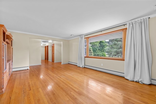 38 Degarmo Hills Rd, Wappingers Falls, NY 12590 - spare room featuring light wood-type flooring, a baseboard radiator, ornamental molding, baseboards, and a baseboard heating unit