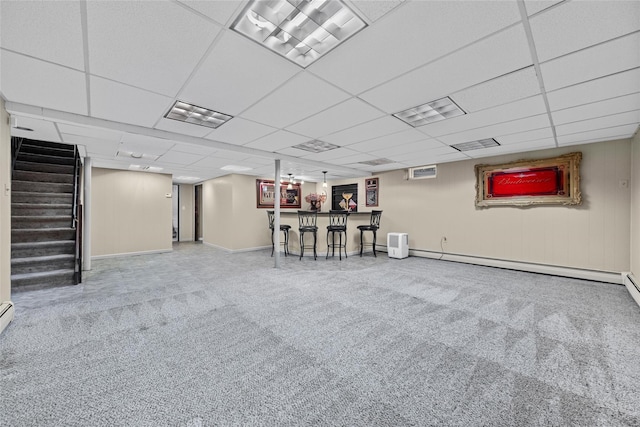38 Degarmo Hills Rd, Wappingers Falls, NY 12590 - finished below grade area with stairway, carpet flooring, a baseboard radiator, a community bar, and baseboards