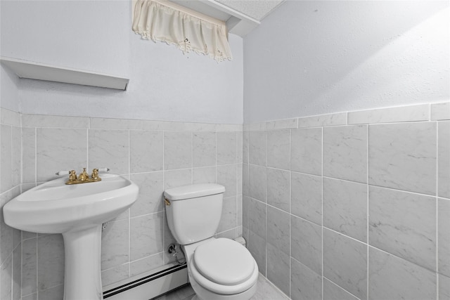 38 Degarmo Hills Rd, Wappingers Falls, NY 12590 - bathroom featuring tile walls, a baseboard heating unit, and toilet