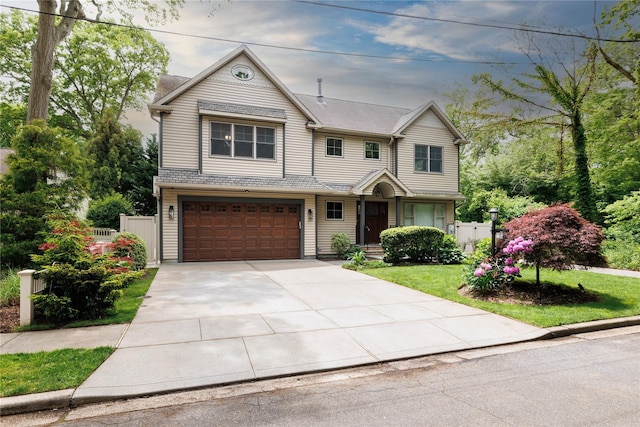 22 Commonwealth Ave, Massapequa, NY 11758 - view of front facade featuring a garage and driveway