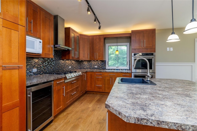 22 Commonwealth Ave, Massapequa, NY 11758 - kitchen with beverage cooler, wall chimney exhaust hood, stainless steel appliances, light wood-style floors, and backsplash