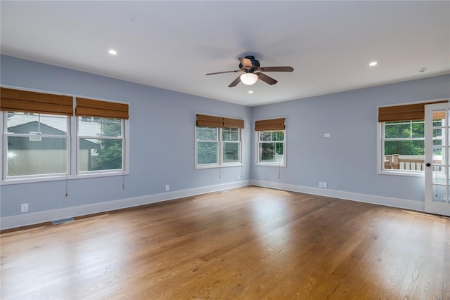 22 Commonwealth Ave, Massapequa, NY 11758 - spare room with healthy amount of natural light, a ceiling fan, wood finished floors, baseboards, and recessed lighting
