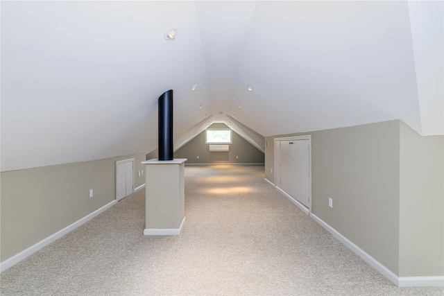 22 Commonwealth Ave, Massapequa, NY 11758 - bonus room with lofted ceiling, light carpet, and baseboards