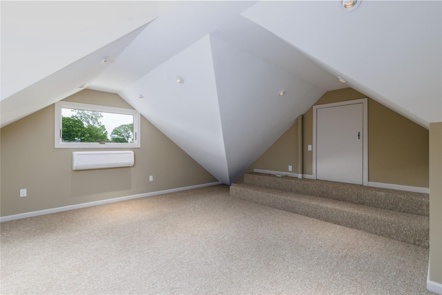 22 Commonwealth Ave, Massapequa, NY 11758 - bonus room with a wall mounted air conditioner, vaulted ceiling, carpet flooring, and baseboards