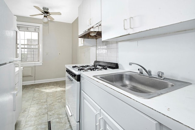 151 Centre Ave Unit 5D, New Rochelle, NY 10805 - kitchen featuring white appliances, under cabinet range hood, tasteful backsplash, a sink, and ceiling fan