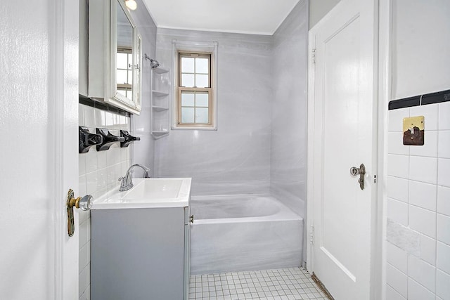 151 Centre Ave Unit 5D, New Rochelle, NY 10805 - bathroom with tile walls, vanity, bathing tub / shower combination, and tile patterned floors