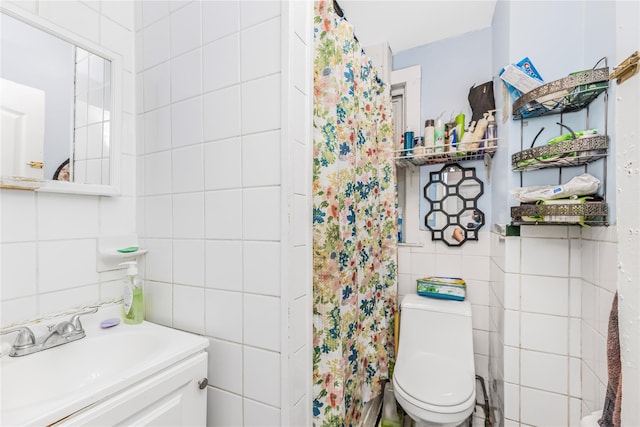 132 Oak St, Yonkers, NY 10701 - full bathroom with tile walls, vanity, and a shower with curtain