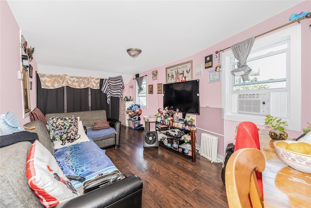 132 Oak St, Yonkers, NY 10701 - living area featuring radiator heating unit, wood finished floors, and cooling unit