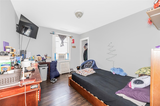 132 Oak St, Yonkers, NY 10701 - bedroom featuring radiator, dark wood finished floors, and cooling unit