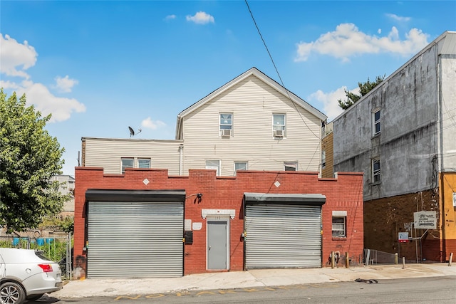 132 Oak St, Yonkers, NY 10701 - back of property featuring brick siding and an attached garage