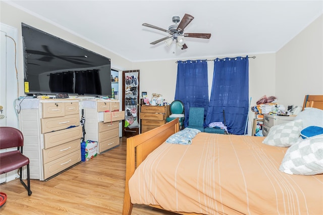 132 Oak St, Yonkers, NY 10701 - bedroom featuring ornamental molding, light wood-style floors, and a ceiling fan