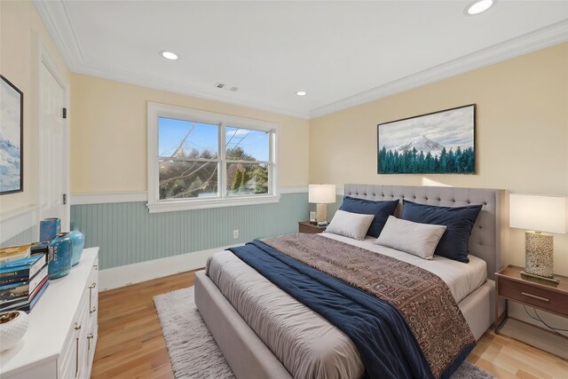 140 Grant Dr, Aquebogue, NY 11931 - bedroom featuring wainscoting, light wood finished floors, crown molding, and recessed lighting
