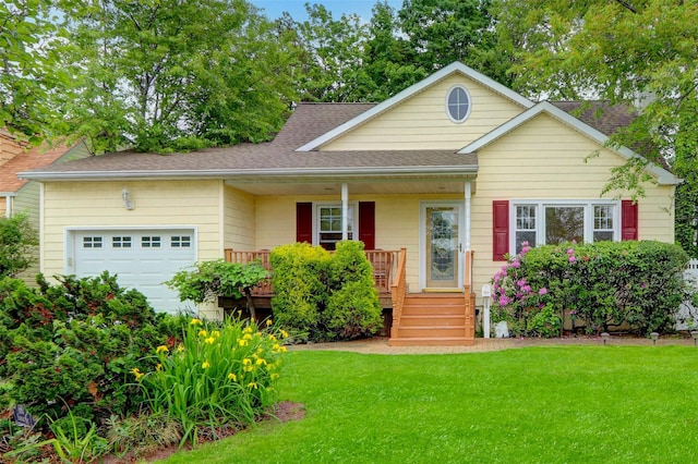 690 Franklin Ave, Massapequa, NY 11758 - view of front of house with an attached garage, a porch, a front lawn, and a shingled roof