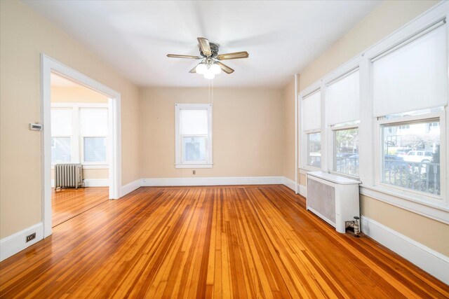 81 Liberty Ave, Rockville Centre, NY 11570 - unfurnished room with radiator, light wood-style floors, and plenty of natural light