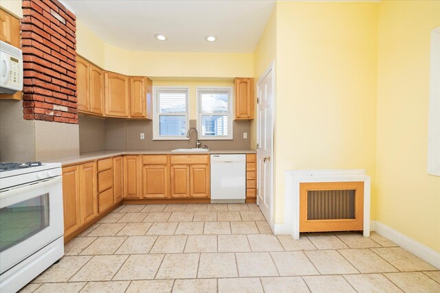 81 Liberty Ave, Rockville Centre, NY 11570 - kitchen with white appliances, a sink, light brown cabinetry, light countertops, and recessed lighting