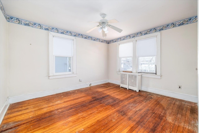 81 Liberty Ave, Rockville Centre, NY 11570 - unfurnished room with radiator heating unit, hardwood / wood-style floors, baseboards, and a ceiling fan