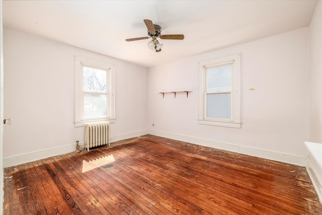 81 Liberty Ave, Rockville Centre, NY 11570 - empty room with radiator, wood-type flooring, ceiling fan, and baseboards