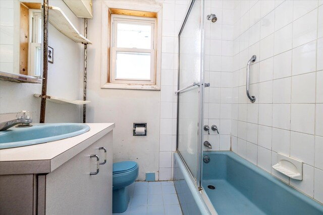 81 Liberty Ave, Rockville Centre, NY 11570 - full bathroom with vanity, toilet, shower / bath combination, and tile patterned flooring