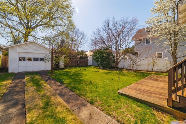 81 Liberty Ave, Rockville Centre, NY 11570 - view of yard featuring an outdoor structure, a detached garage, driveway, and a wooden deck
