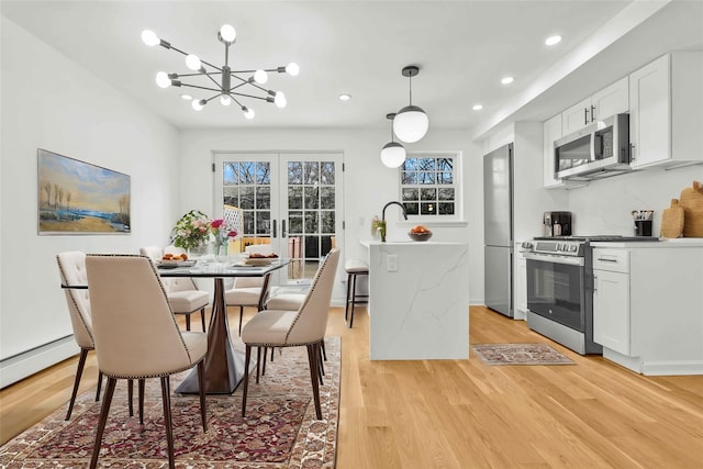 3951 45th St Unit 1, Sunnyside, NY 11104 - dining room with light wood finished floors, a chandelier, recessed lighting, and a baseboard radiator