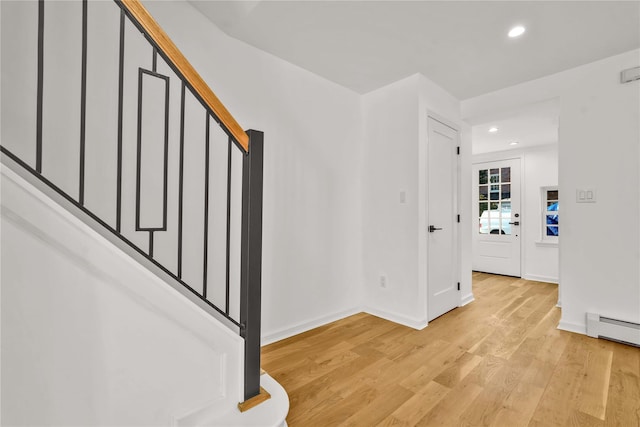 3951 45th St Unit 1, Sunnyside, NY 11104 - foyer entrance with light wood finished floors, recessed lighting, stairway, baseboards, and a baseboard radiator