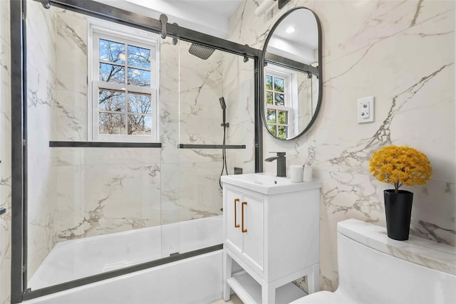 3951 45th St Unit 1, Sunnyside, NY 11104 - bathroom featuring enclosed tub / shower combo, vanity, toilet, and tile walls