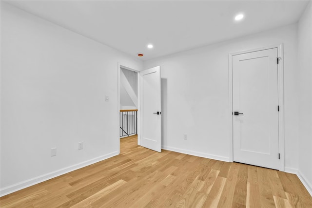 3951 45th St Unit 1, Sunnyside, NY 11104 - unfurnished bedroom featuring light wood finished floors, baseboards, and recessed lighting