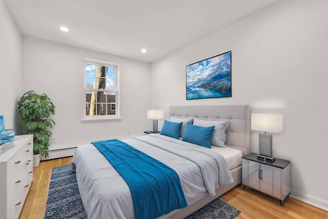 3951 45th St Unit 1, Sunnyside, NY 11104 - bedroom with light wood finished floors, a baseboard radiator, and recessed lighting