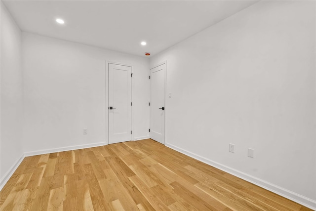 3951 45th St Unit 1, Sunnyside, NY 11104 - unfurnished bedroom with light wood-type flooring, baseboards, and recessed lighting
