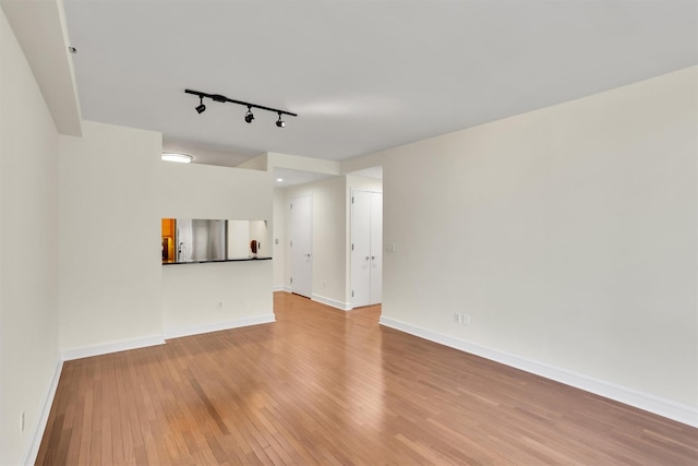 120 Riverside Blvd Unit 10T, New York Manhattan, NY 10069 - unfurnished room with track lighting, light wood-style flooring, and baseboards