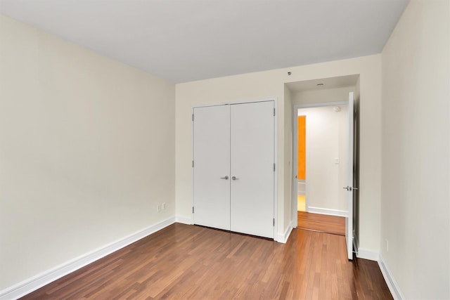 120 Riverside Blvd Unit 10T, New York Manhattan, NY 10069 - unfurnished bedroom with dark wood finished floors, a closet, and baseboards