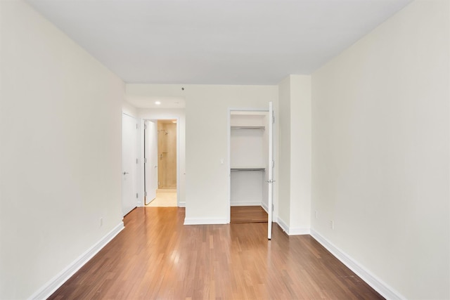 120 Riverside Blvd Unit 10T, New York Manhattan, NY 10069 - unfurnished bedroom with wood finished floors, baseboards, a closet, a spacious closet, and recessed lighting