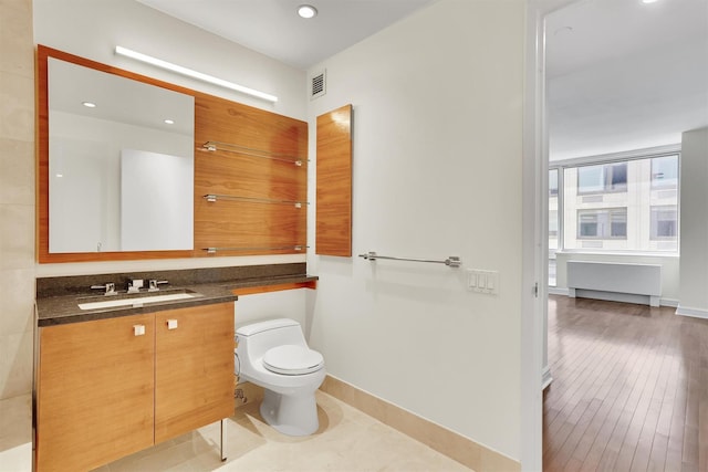 120 Riverside Blvd Unit 10T, New York Manhattan, NY 10069 - bathroom featuring toilet, vanity, baseboards, recessed lighting, and wood finished floors