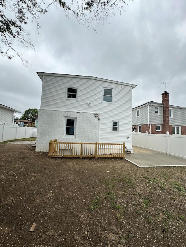 84 Windsor, Hempstead, NY 11550 - back of house with a patio, brick siding, and a wooden deck