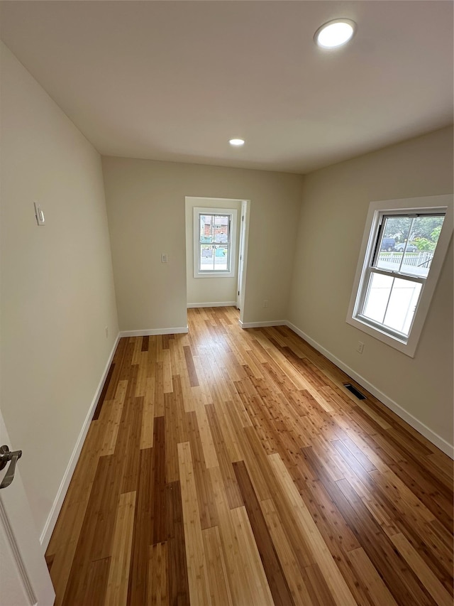 84 Windsor, Hempstead, NY 11550 - spare room with light wood-style floors, baseboards, and recessed lighting