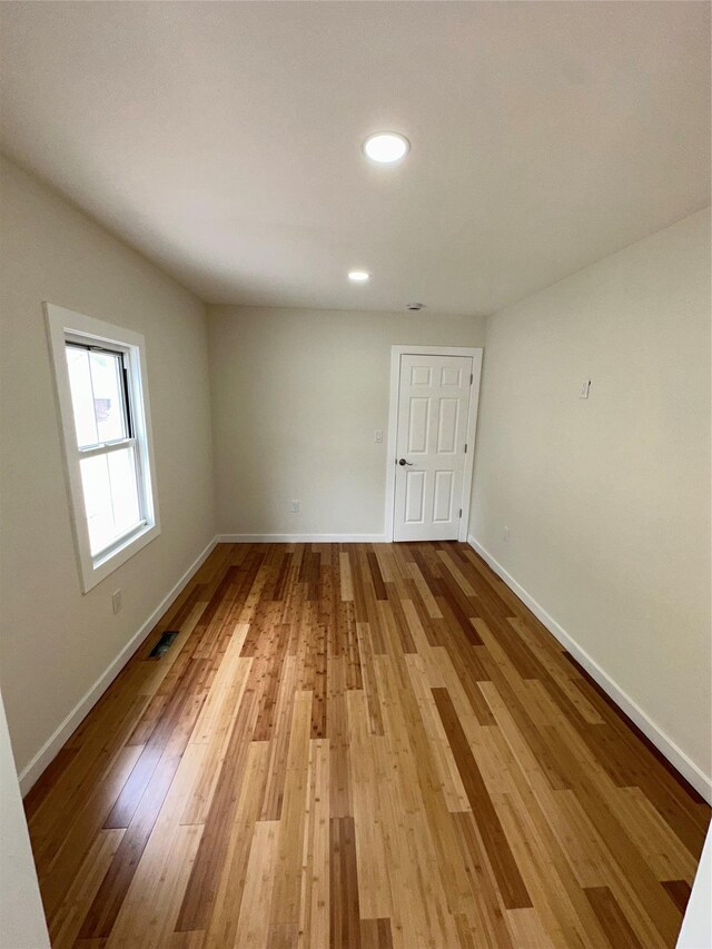 84 Windsor, Hempstead, NY 11550 - unfurnished room with light wood-type flooring, baseboards, and recessed lighting