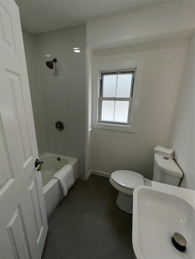 84 Windsor, Hempstead, NY 11550 - full bath featuring toilet,  shower combination, and tile patterned floors