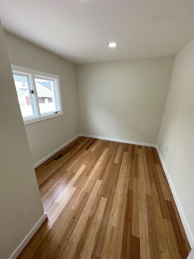 84 Windsor, Hempstead, NY 11550 - spare room with baseboards, light wood-style flooring, and recessed lighting