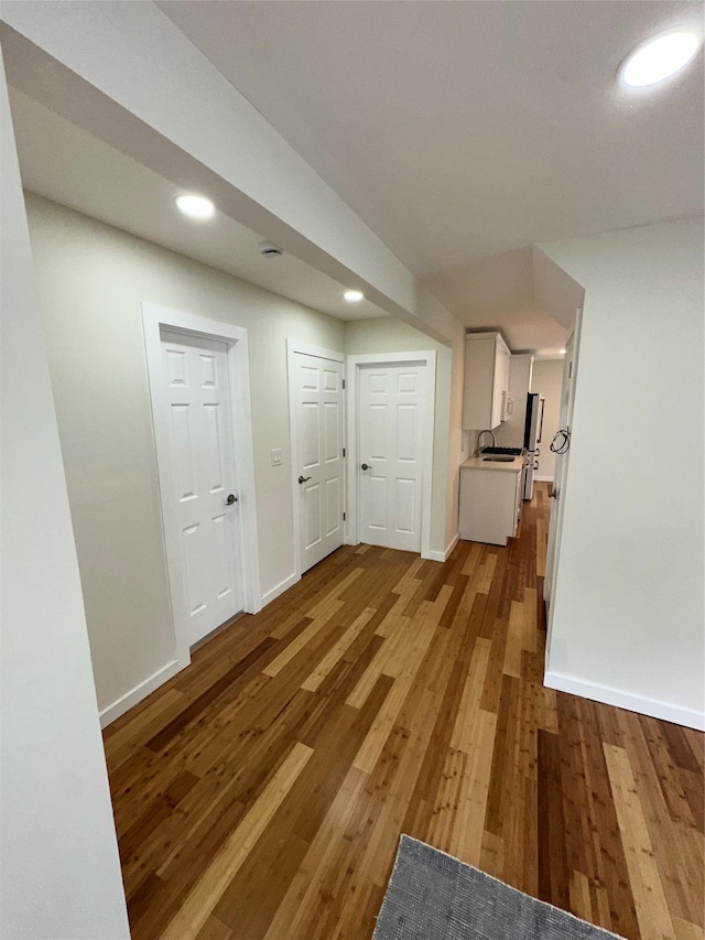 84 Windsor, Hempstead, NY 11550 - unfurnished living room with light wood-style flooring, baseboards, and recessed lighting